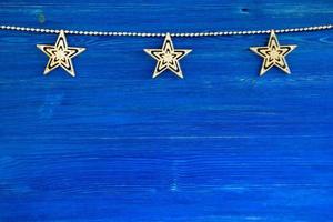 Christmas decorations on the blue wooden background, top view. photo