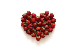 A heart from strawberry on the white background. photo