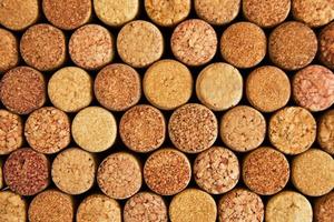 Background from textured wine corks closeup, top view. photo