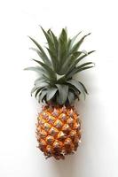 A pineapple closeup on the white background. photo