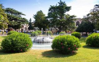 Verona, Italy - June 2022 - the Fountain of Alps, located in Piazza Bra garden. photo