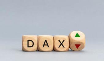 Concept of German Stock Index DAX changing the trend and goes up or down. Block shape with text and arrows. Copy space photo