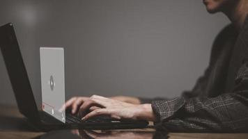 hands of women using laptop for streaming online, watching video on internet, live concert, show or tutorial photo