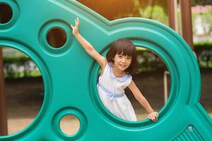 Active little girl on playground photo