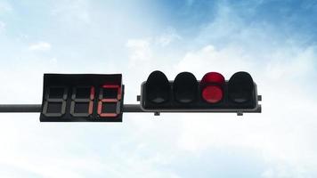 Red traffic light with the countdown number twelve. Background of blue sky and white clouds. photo