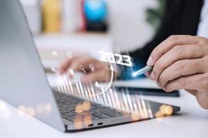 Business and Technology target set goals and achievement in 2023 new year resolution statistics graph rising revenue, planning to start up strategy, icon concept photo