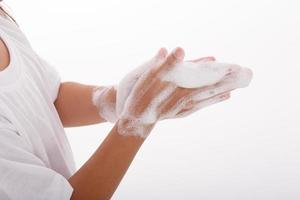 little girl hand washing hands,on white background photo