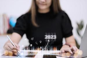Business and Technology target set goals and achievement in 2023 new year resolution statistics graph rising revenue, planning to start up strategy, icon concept photo