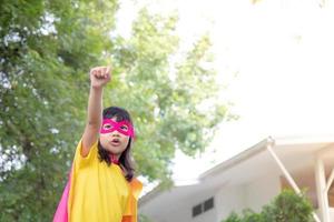 Child acts like a superhero to save the world photo