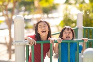 Child playing on the outdoor playground. Kids play in school or kindergarten yard. photo