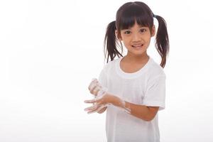 child washing hands and showing soapy palms.on white background photo