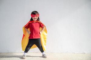 Child acts like a superhero to save the world photo