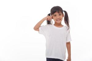 portrait of a cute little girl thinking isolated on white photo