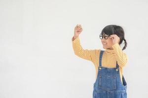 Little children painting on white wall photo