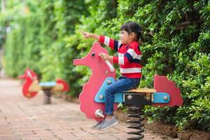 Active little girl on playground photo