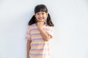 Portrait of happy smiling child girl isolated on white background photo