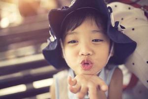 little girl sends kiss photo