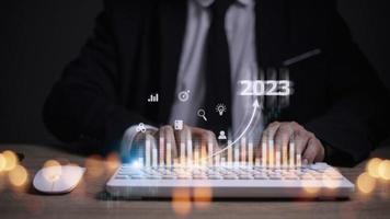 Business and Technology target set goals and achievement in 2023 new year resolution statistics graph rising revenue, planning to start up strategy, icon concept photo