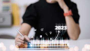 Business and Technology target set goals and achievement in 2023 new year resolution statistics graph rising revenue, planning to start up strategy, icon concept photo