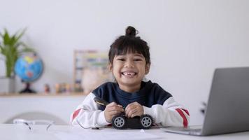 Asia students learn at home in coding robot cars and electronic board cables in STEM, STEAM, mathematics engineering science technology computer code in robotics for kids concept. photo