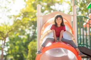 Active little girl on playground photo