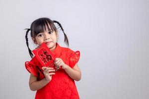 happy Chinese new year. smiling Asian little girls holding red envelope photo