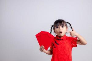 happy Chinese new year. smiling Asian little girls holding red envelope photo