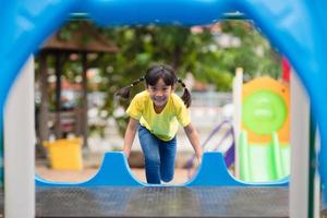 Active little girl on playground photo