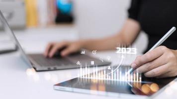 Business and Technology target set goals and achievement in 2023 new year resolution statistics graph rising revenue, planning to start up strategy, icon concept photo