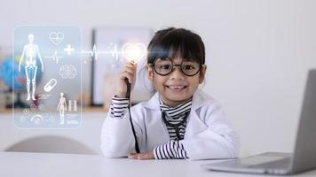 children with stethoscope in hand toching medical icon network connection on modern virtual screen networking inerface, medical technology photo