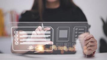 Electronic signature and paperless office concept. A person uses a pen to sign electronic documents on digital documents on a virtual screen. E-signing. Technology and document management photo