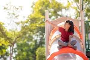 Active little girl on playground photo