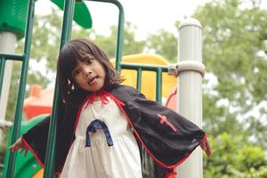 Children in costumes going to trick or treat photo