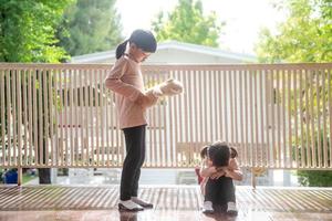 two little girl fighting over bear photo