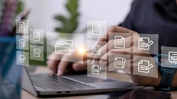Businessman with Document Management System DMS Online Document Database and automated processes in file management Search and manage document database files online. photo