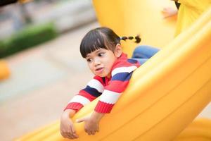 Active little girl on playground photo