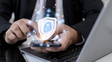 Cyber security. Data protection concept. Banking security. Hands touching digital icon padlock and network connection on mobile smartphone, virtual interface screen. photo