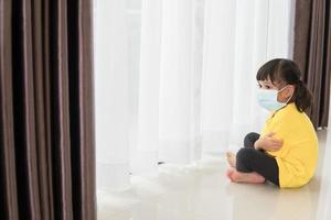 children in medical mask stay isolation at home for self quarantine. Concept home quarantine, prevention COVID-19, Coronavirus outbreak situation photo