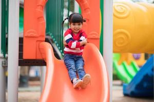 Active little girl on playground photo