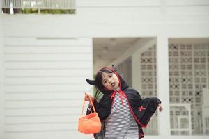 Funny child dressed Halloween costume. Halloween holidays concept photo