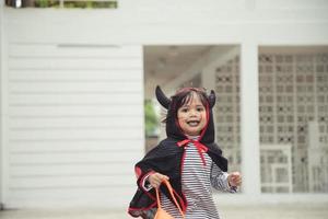 Funny child dressed Halloween costume. Halloween holidays concept photo