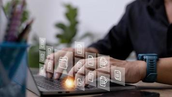 Businessman with Document Management System DMS Online Document Database and automated processes in file management Search and manage document database files online. photo