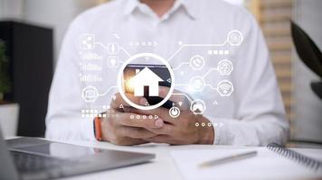 Smart home control with Smartphone,Lifestyle of person in modern life internet of things, Smart house technology.The new innovation of the Future. photo