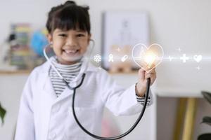 children with stethoscope in hand toching medical icon network connection on modern virtual screen networking inerface, medical technology photo