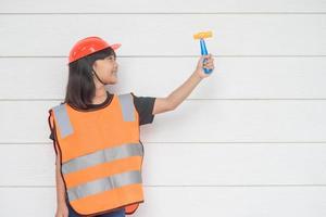 Asian girl children playing as an engineer helmet photo