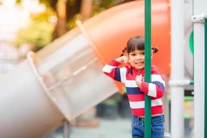 Active little girl on playground photo