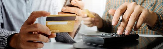 Woman hand using mobile smart phone, online payment, banking and online shopping at the home. photo