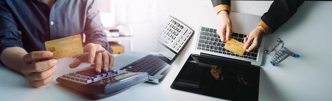 Woman hand using mobile smart phone, online payment, banking and online shopping at the home. photo