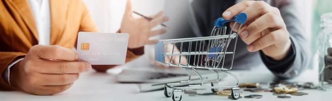 Woman hand using mobile smart phone, online payment, banking and online shopping at the home. photo