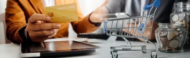 Woman hand using mobile smart phone, online payment, banking and online shopping at the home. photo